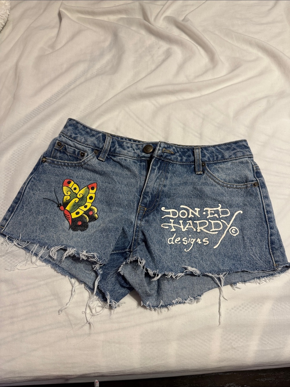 Fashion Nova Blue Denim Cutoff Shorts with Yellow Butterfly and White Script